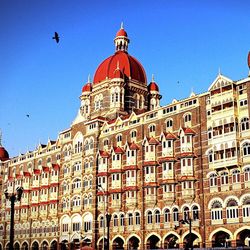 Low angle view of building against clear blue sky