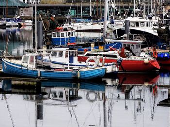 Boats moored at harbor