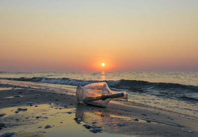 Message in a bottle at sunset