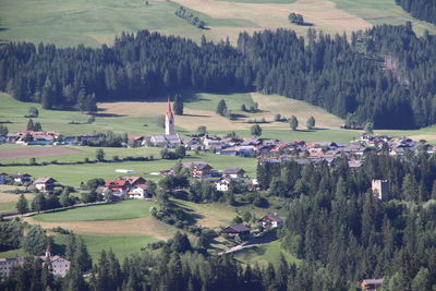 Panoramic view of trees and houses on field