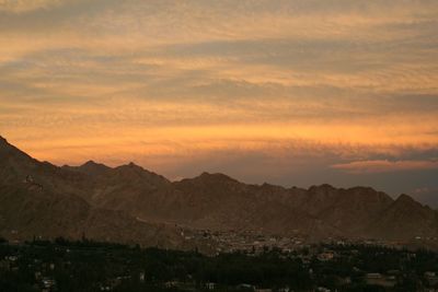 Scenic view of mountains against sky during sunset