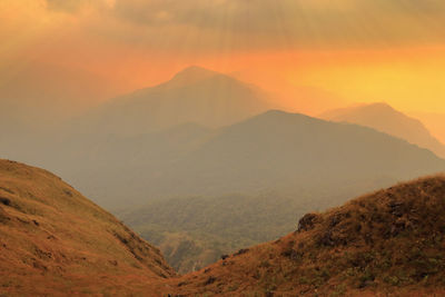 Scenic view of mountains against sky during sunset