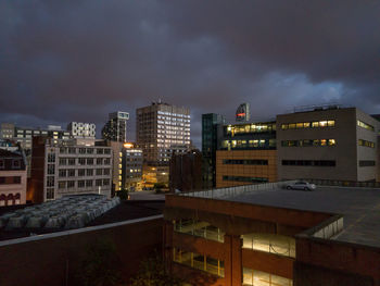 High angle view of buildings in city at night