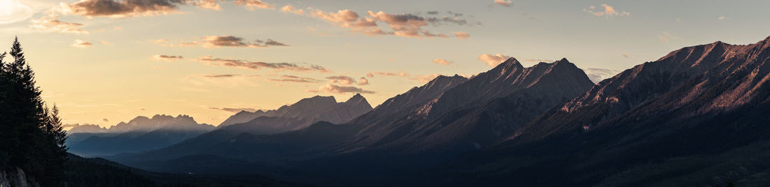 Panoramic view of mountains against sky during sunset