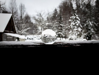 Close-up of crystal ball on snow