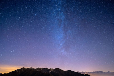 Low angle view of stars against sky at night