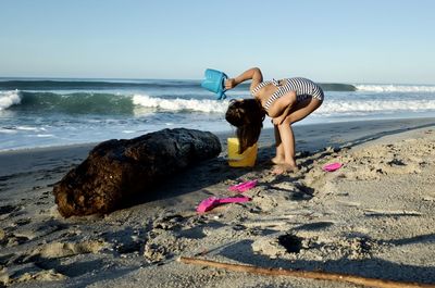 Full length of woman on beach