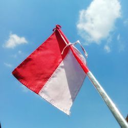 Low angle view of flag against sky