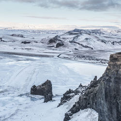 Scenic view of frozen landscape against sky