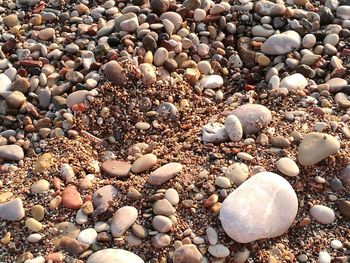 High angle view of pebbles on beach