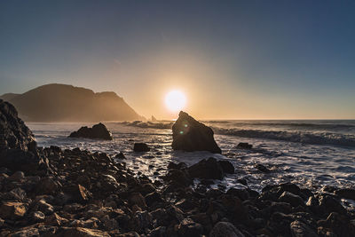 Scenic view of sea against sky during sunset