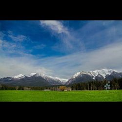 Scenic view of landscape against cloudy sky