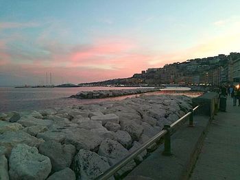 Panoramic view of beach against sky during sunset