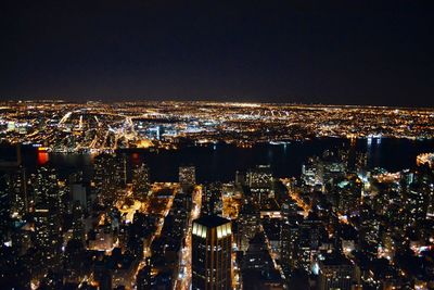 Aerial view of illuminated cityscape at night