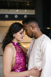 Side view of young woman looking up