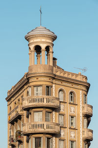 Low angle view of building against blue sky