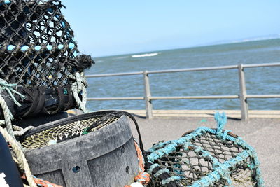 Stack of rope on beach against clear sky