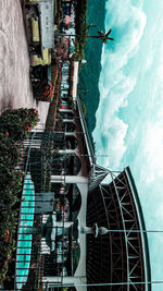 High angle view of amusement park against cloudy sky