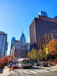 View of modern buildings against clear blue sky