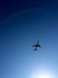 Low angle view of airplane flying in sky