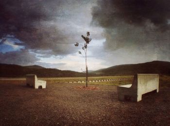 Scenic view of landscape against cloudy sky