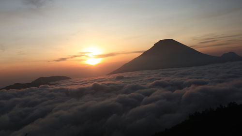 Scenic view of mountains against sky during sunset