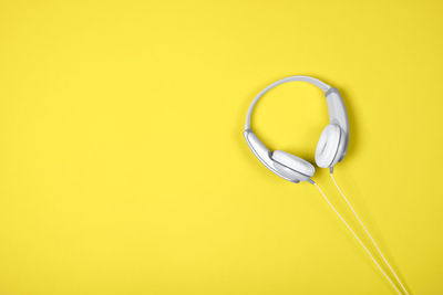 Close-up of heart shape against yellow background