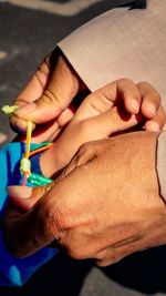 Close-up of man holding hands