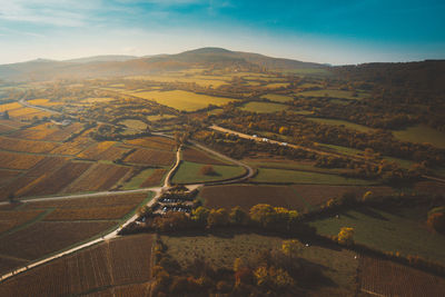 Aerial view of agricultural field against sky