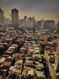 High angle view of buildings in city against sky