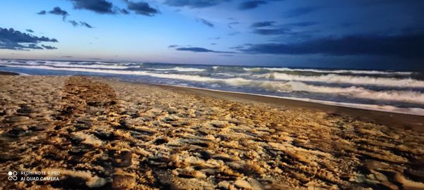 Scenic view of beach against sky