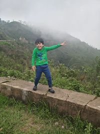 Full length of young man playing on field