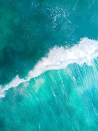 Sea waves splashing in swimming pool