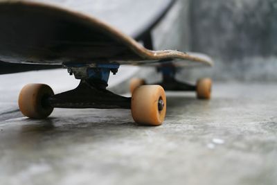 Close-up of skateboard on the ground