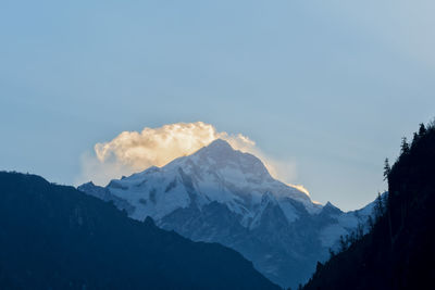 Scenic view of snowcapped mountains against sky