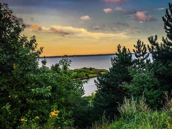 Scenic view of calm lake against sky