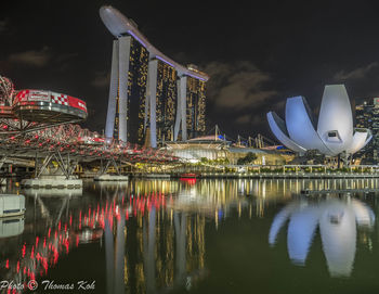 Illuminated buildings in city at night