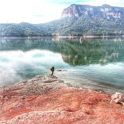 View of calm lake against mountain range