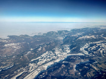Aerial view of landscape against sky during winter