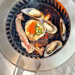 High angle view of meat on barbecue grill