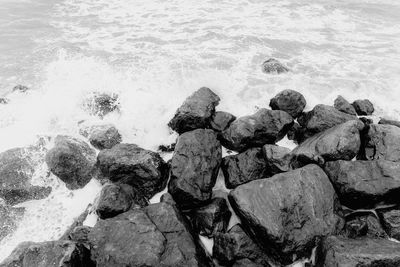 High angle view of rocks in sea