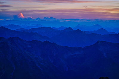 Scenic view of mountains against sky during sunset