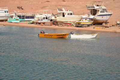 Boats moored in sea