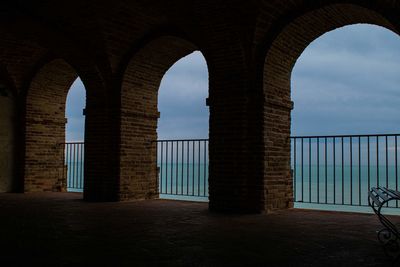 Arch bridge against sky