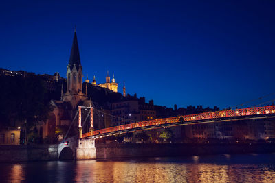 Bridge over river at night