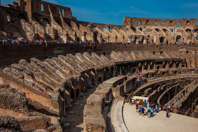 View of the interior of the roman colosseum showing the arena and the hypogeum in a sunny day