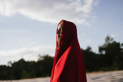 Woman in a red scarf in sunny weather