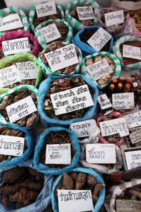 High angle view of various food in sacks for sale at market
