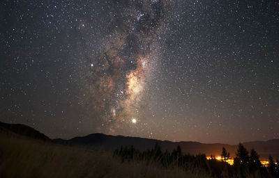 Scenic view of star field against sky at night