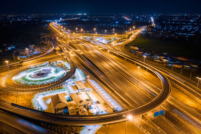 Aerial view of light trails on elevated road at night